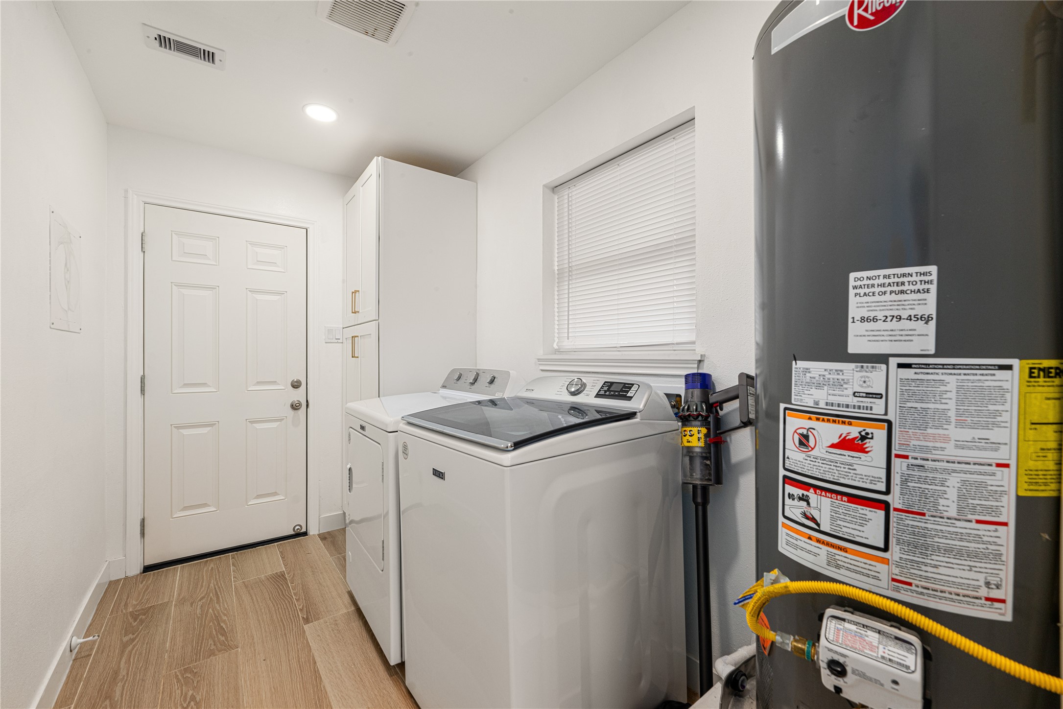 3410 Tanglewilde Street Houston, TX 77063 - Photo 15 of 17 a utility room with dryer and washer