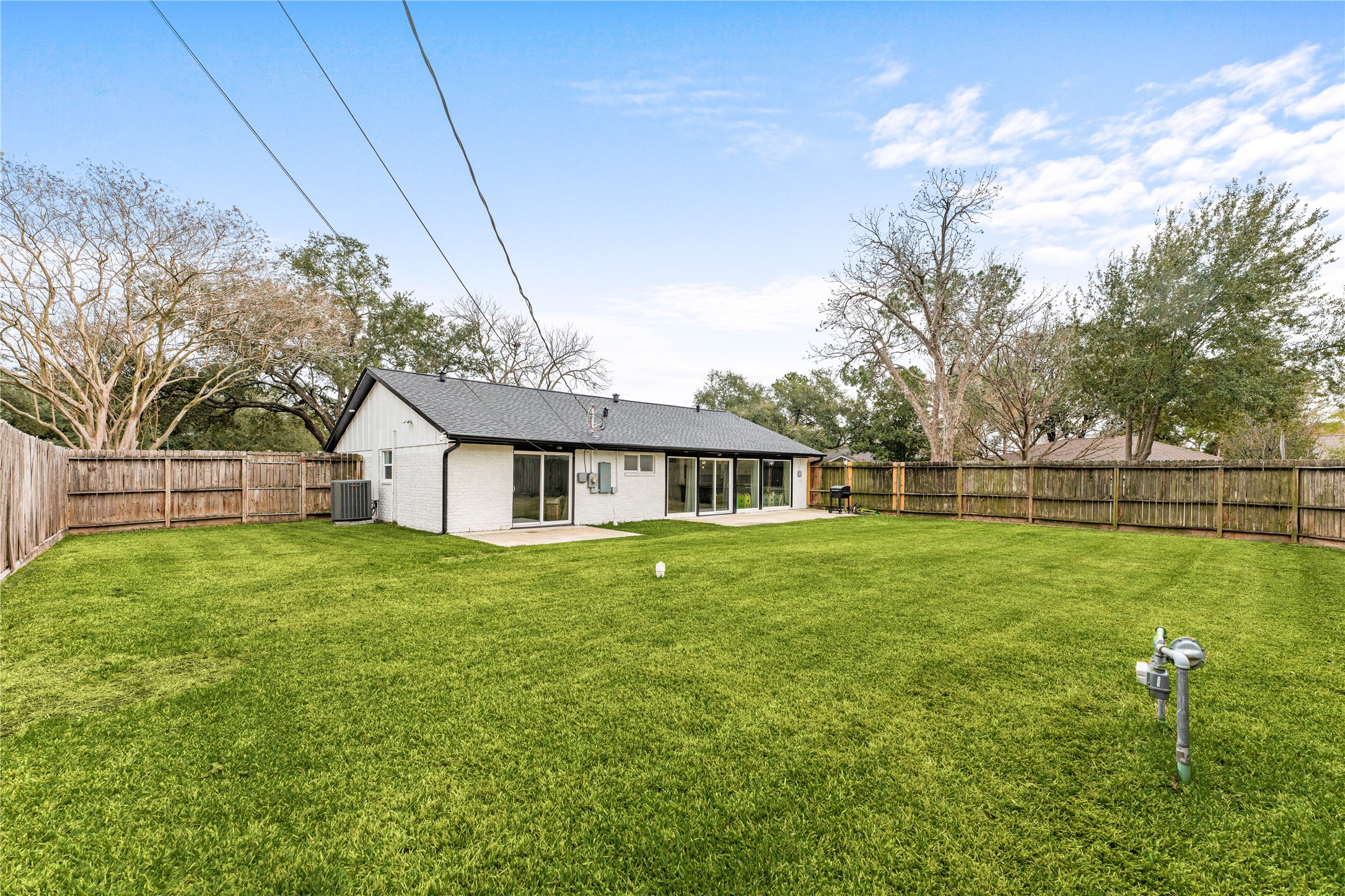 3410 Tanglewilde Street Houston, TX 77063 - Photo 17 of 17 a view of a house with a big yard plants and large trees