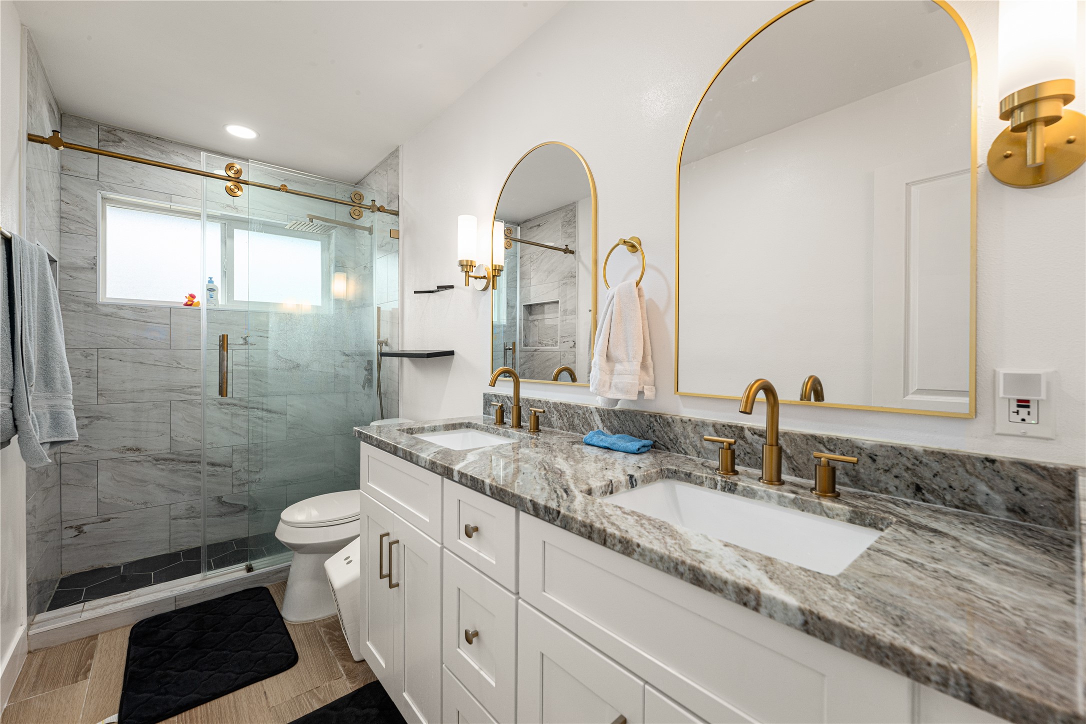 3410 Tanglewilde Street Houston, TX 77063 - Photo 10 of 17 a bathroom with a granite countertop sink toilet and shower