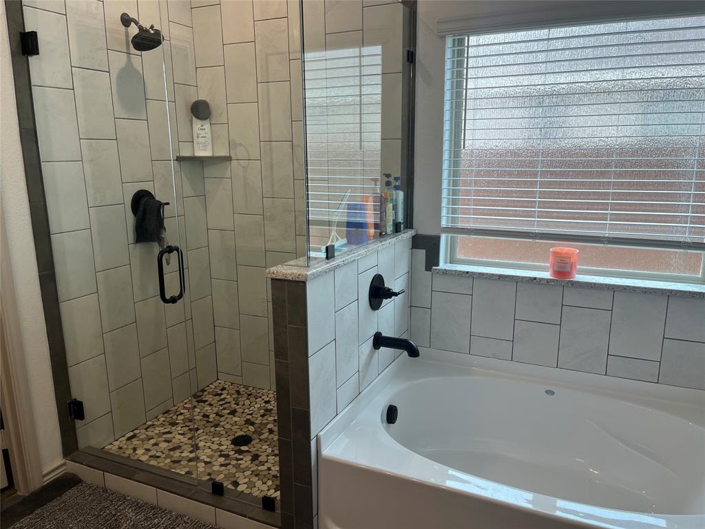 108 Wiley Stephenville, TX 76401 - Photo 14 of 25 a bathroom with a bath tub and shower