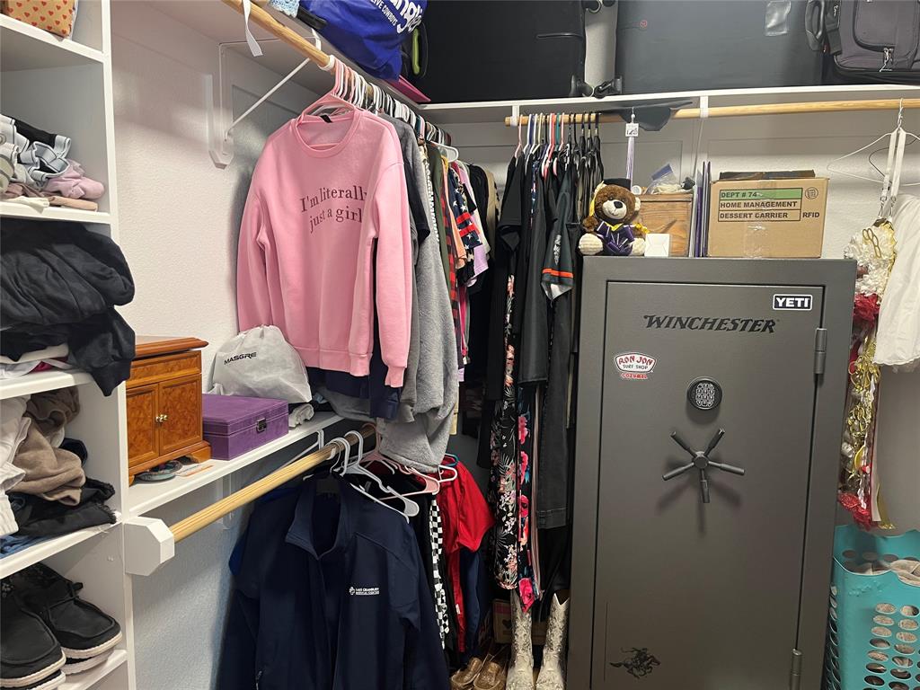 108 Wiley Stephenville, TX 76401 - Photo 15 of 25 a view of walk in closet with clothes and shoes