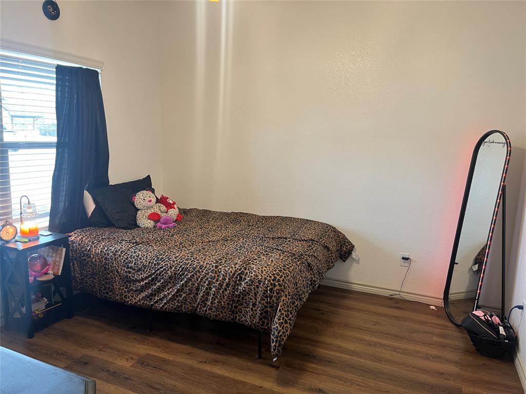 108 Wiley Stephenville, TX 76401 - Photo 9 of 25 a bedroom with a bed and a flat screen tv