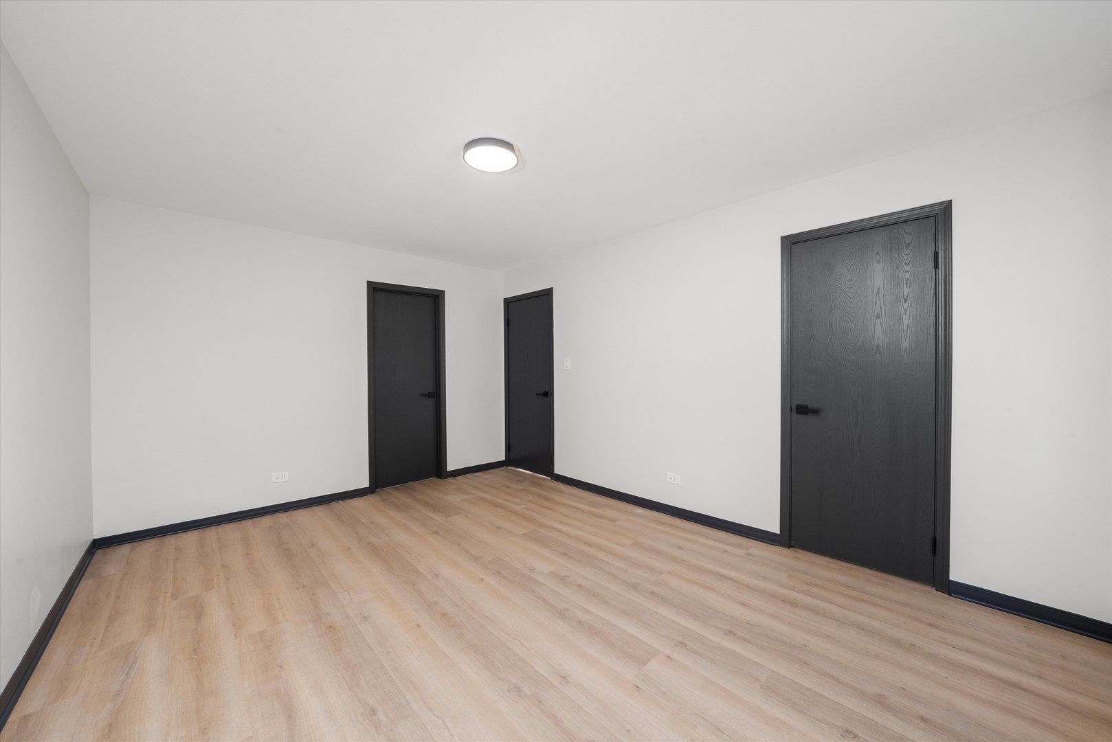 8040 Geneva Street Woodridge, IL 60517 - Photo 13 of 32 a view of an empty room with wooden floor