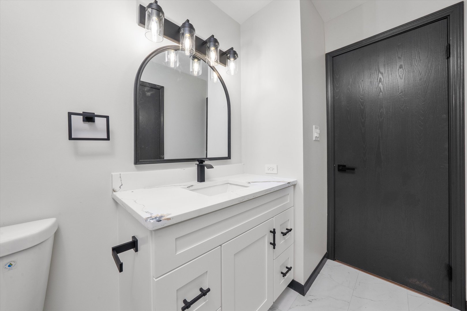 8040 Geneva Street Woodridge, IL 60517 - Photo 14 of 32 a bathroom with a sink and a mirror