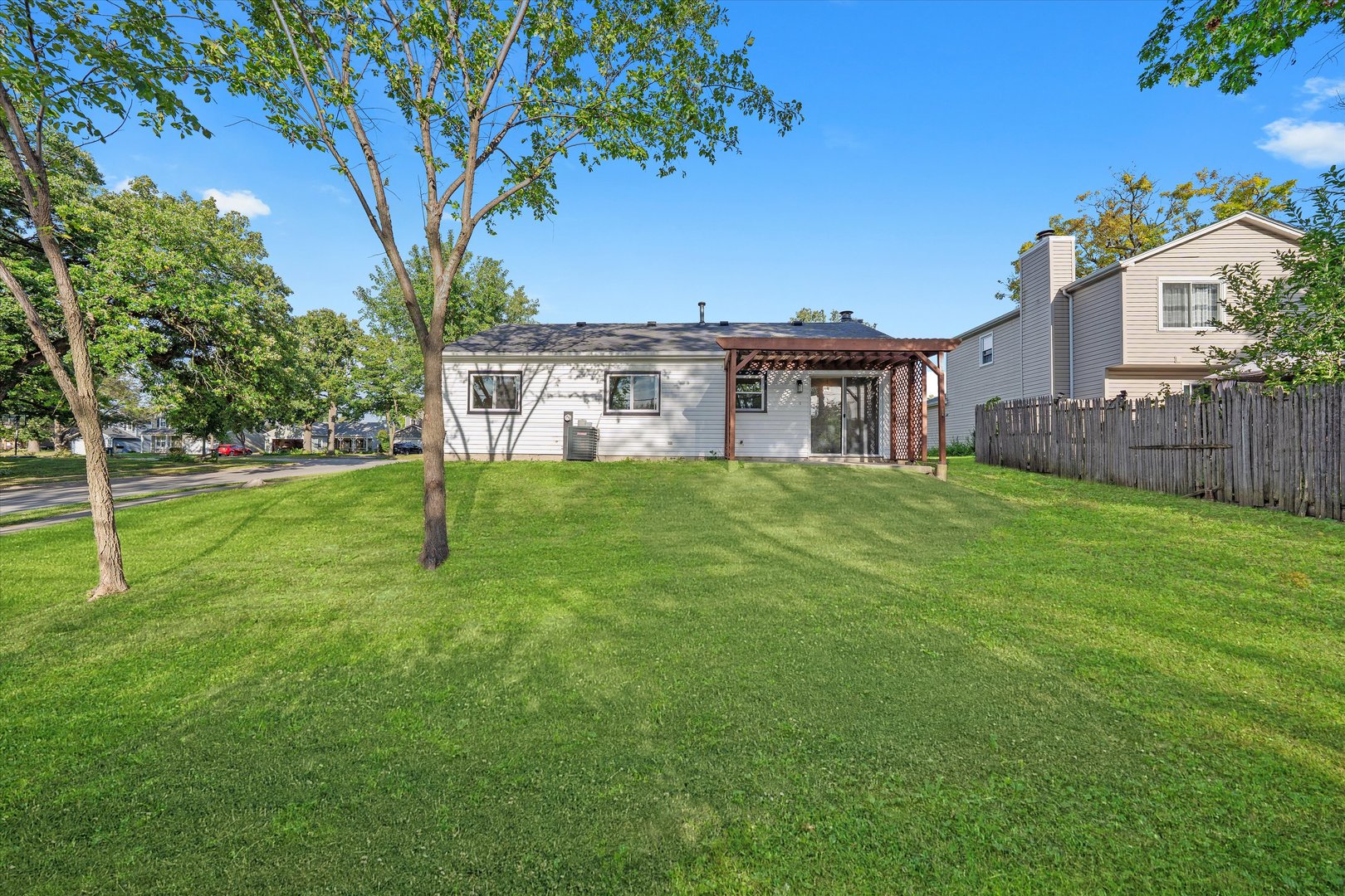 8040 Geneva Street Woodridge, IL 60517 - Photo 26 of 32 a view of a house with a yard