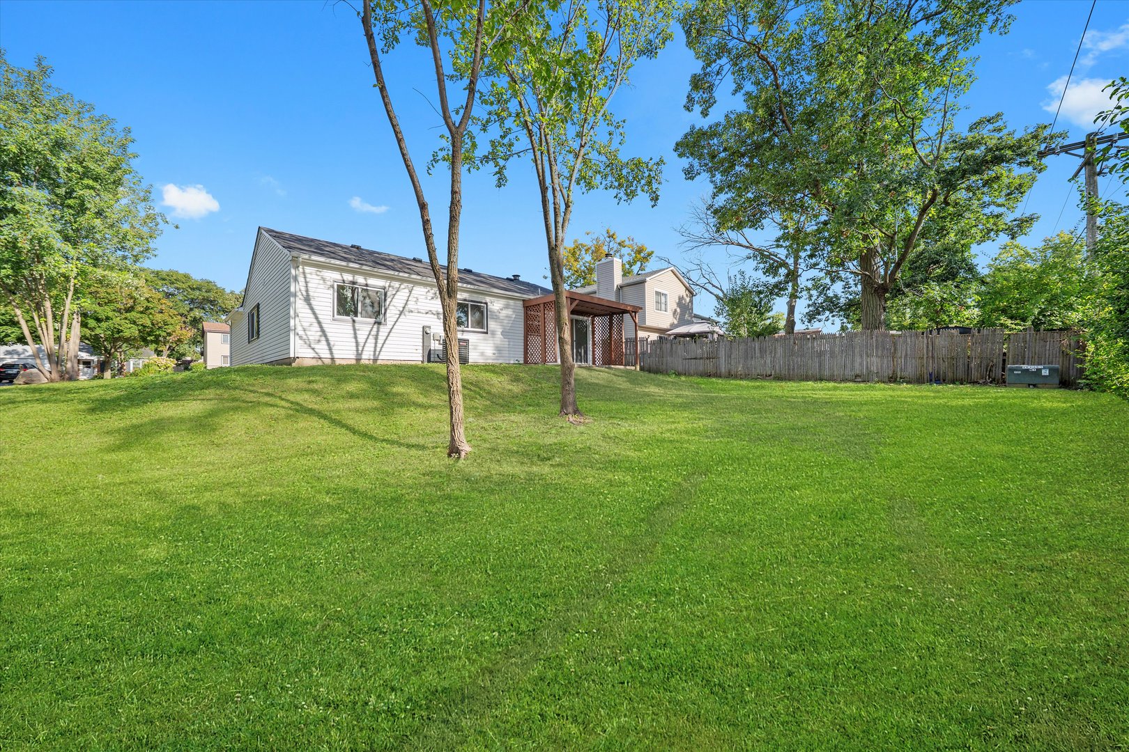 8040 Geneva Street Woodridge, IL 60517 - Photo 27 of 32 a view of a house with a yard