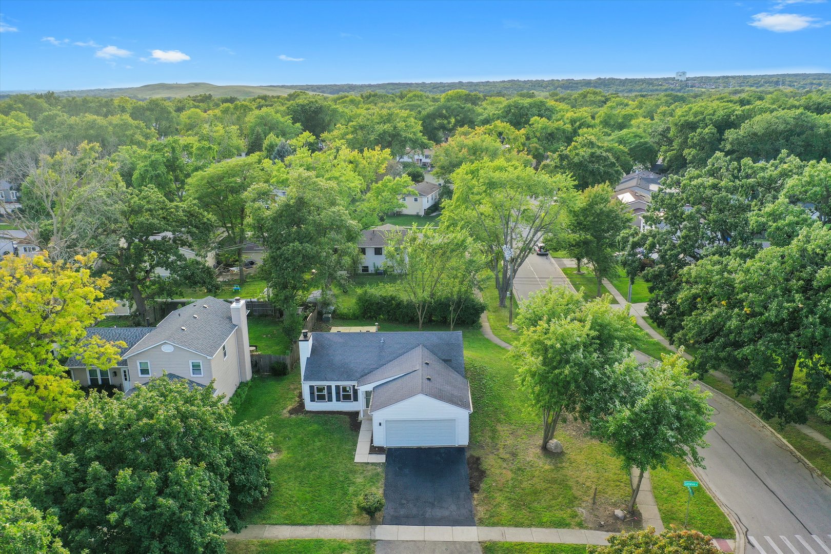 8040 Geneva Street Woodridge, IL 60517 - Photo 29 of 32 an aerial view of residential houses with outdoor space and trees