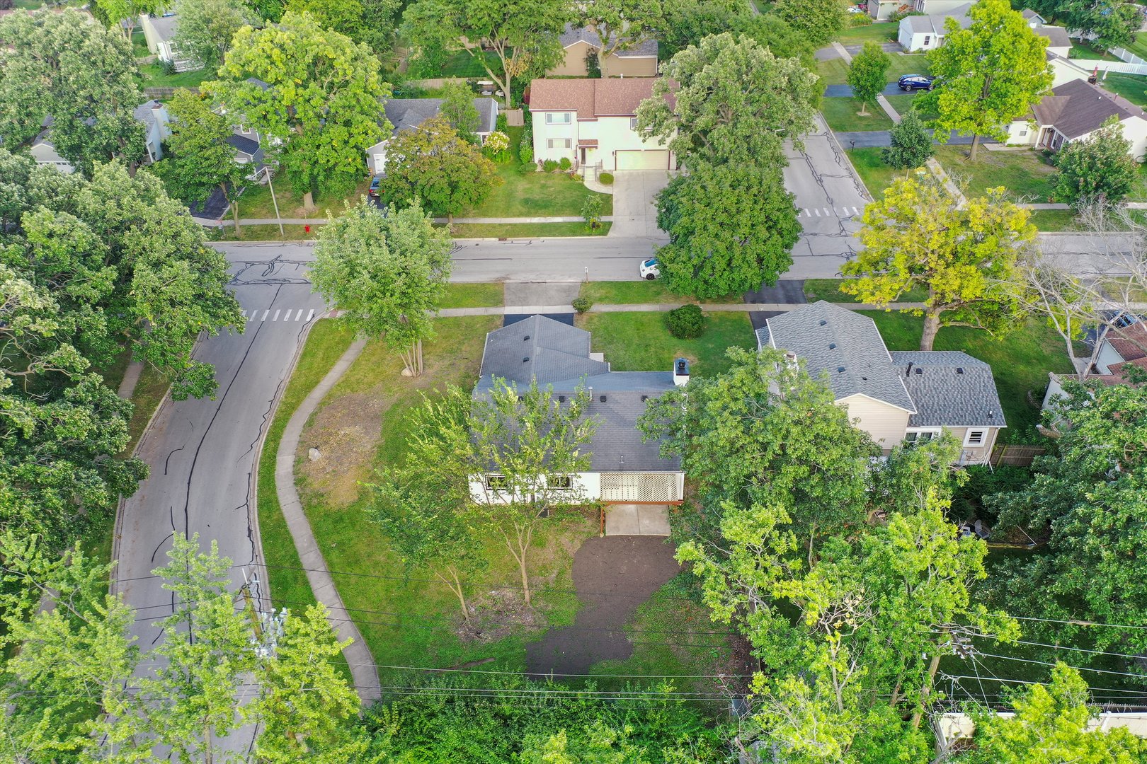 8040 Geneva Street Woodridge, IL 60517 - Photo 31 of 32 an aerial view of a house with a yard and lake view