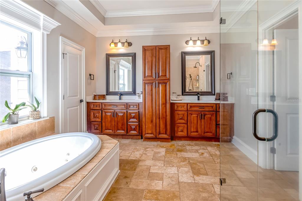 34175 Steeple Chase Way Callahan, FL 32011 - Photo 21 of 66 a bathroom with a tub a sink and a shower