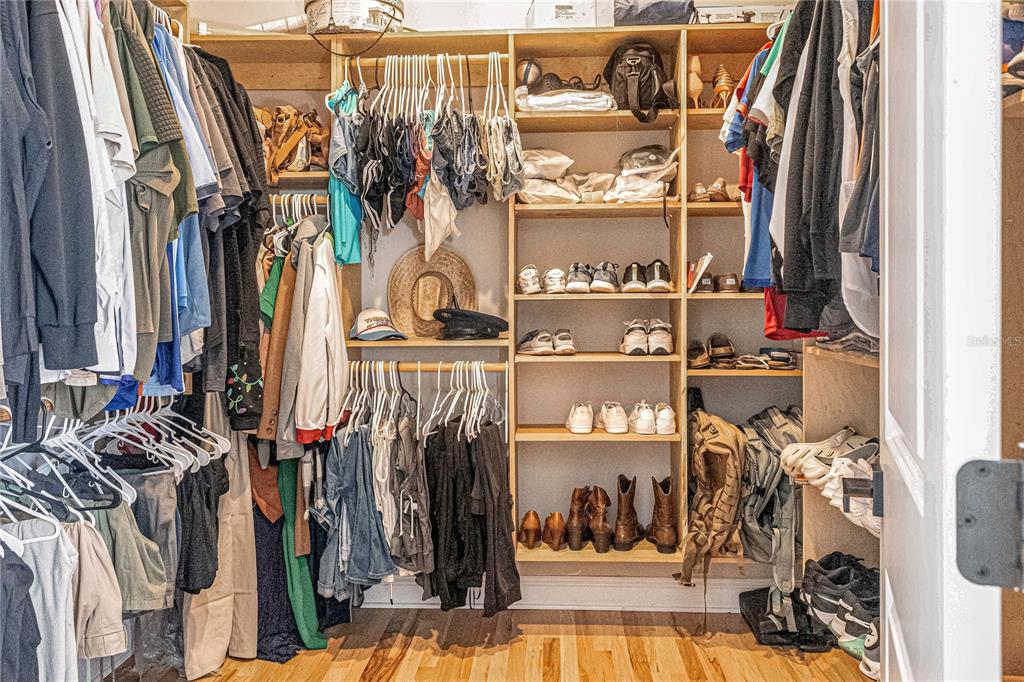 34175 Steeple Chase Way Callahan, FL 32011 - Photo 23 of 66 a view of walk in closet with clothes and shoes
