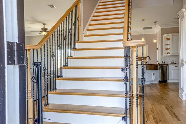 a bedroom with a bed and dresser with mirror