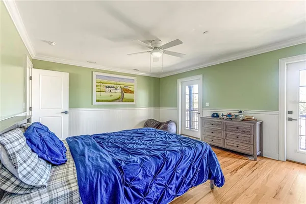 a bedroom with a bed and a tv