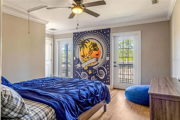 a view of a livingroom with furniture a ceiling fan and window