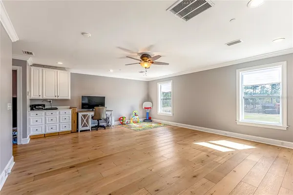 a bathroom with a toilet a sink and a window