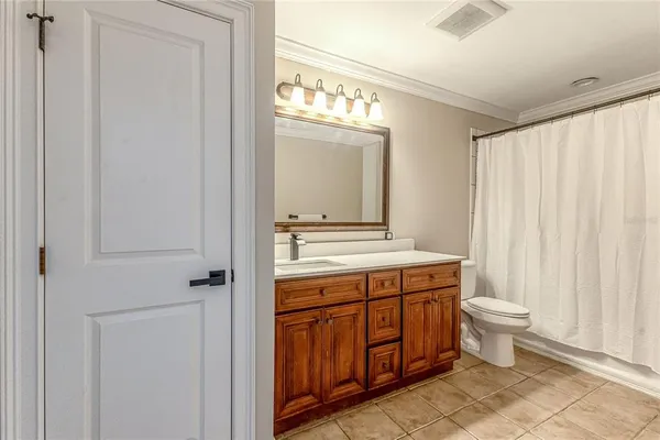 a view of a house with a backyard and garage