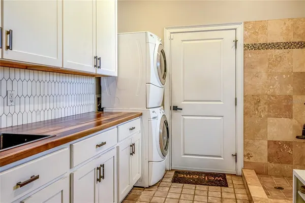 a view of a hallway with wooden shelves