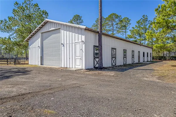 a view of street with wooden fence