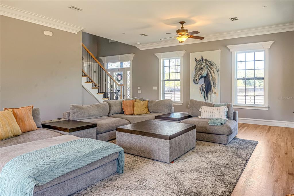 34175 Steeple Chase Way Callahan, FL 32011 - Photo 7 of 66 a living room with furniture and a large window