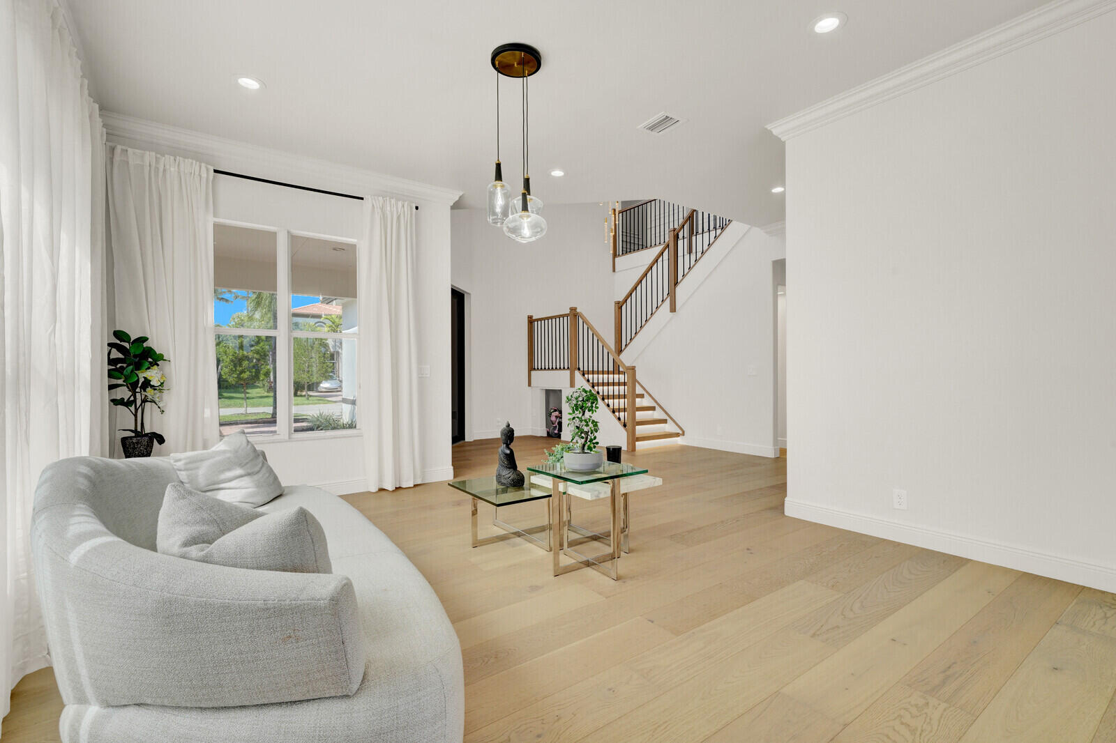 8685 Cobblestone Point Circle Boynton Beach, FL 33472 - Photo 11 of 70 a living room with furniture and a large window