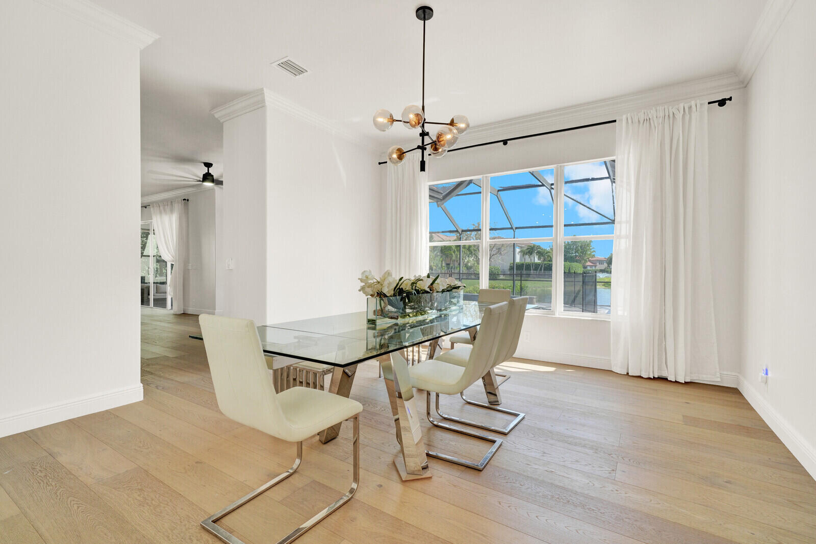 8685 Cobblestone Point Circle Boynton Beach, FL 33472 - Photo 12 of 70 a view of a dining room with furniture window and wooden floor