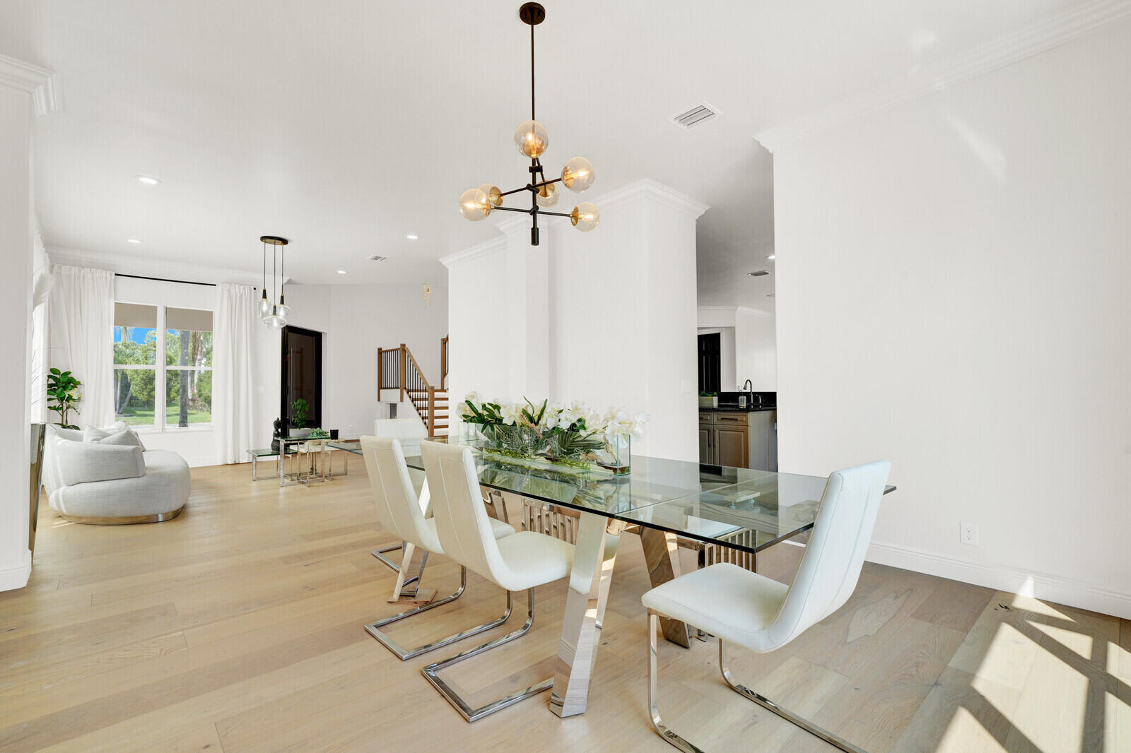 8685 Cobblestone Point Circle Boynton Beach, FL 33472 - Photo 14 of 70 a dining room with furniture a chandelier and wooden floor