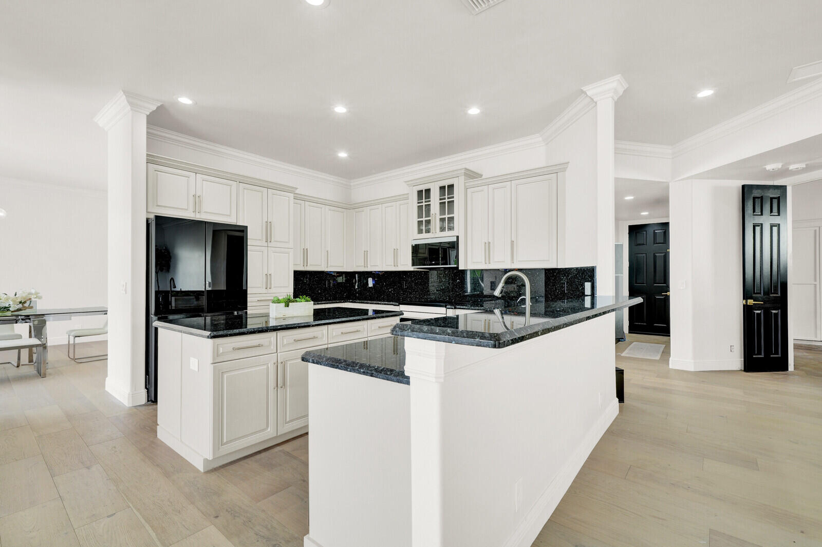 8685 Cobblestone Point Circle Boynton Beach, FL 33472 - Photo 17 of 70 a kitchen with stainless steel appliances granite countertop a stove top oven a refrigerator a sink and a refrigerator