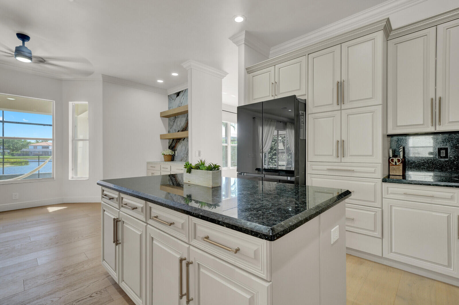 8685 Cobblestone Point Circle Boynton Beach, FL 33472 - Photo 19 of 70 a kitchen with stainless steel appliances granite countertop a sink a stove and a refrigerator