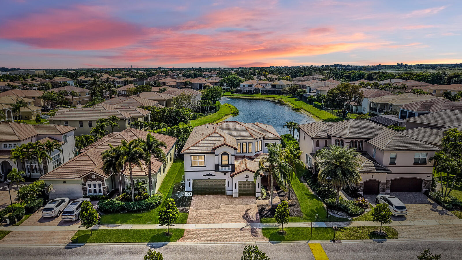 8685 Cobblestone Point Circle Boynton Beach, FL 33472 - Photo 2 of 70 an aerial view of a house with a garden and lake view