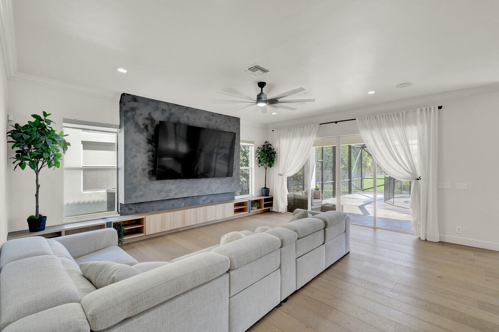 8685 Cobblestone Point Circle Boynton Beach, FL 33472 - Photo 26 of 70 a living room with furniture and a flat screen tv