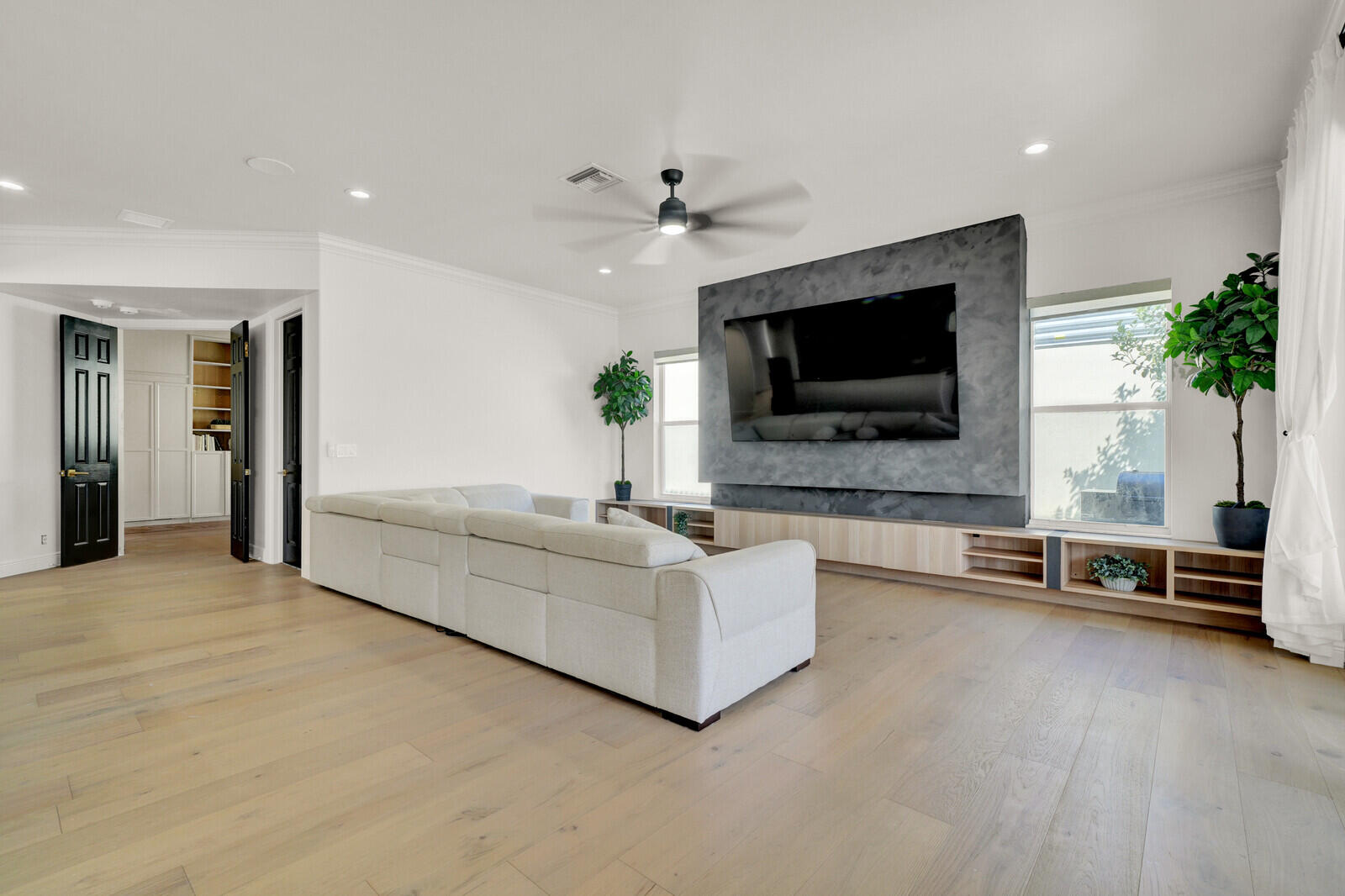 8685 Cobblestone Point Circle Boynton Beach, FL 33472 - Photo 27 of 70 a living room with furniture and a flat screen tv