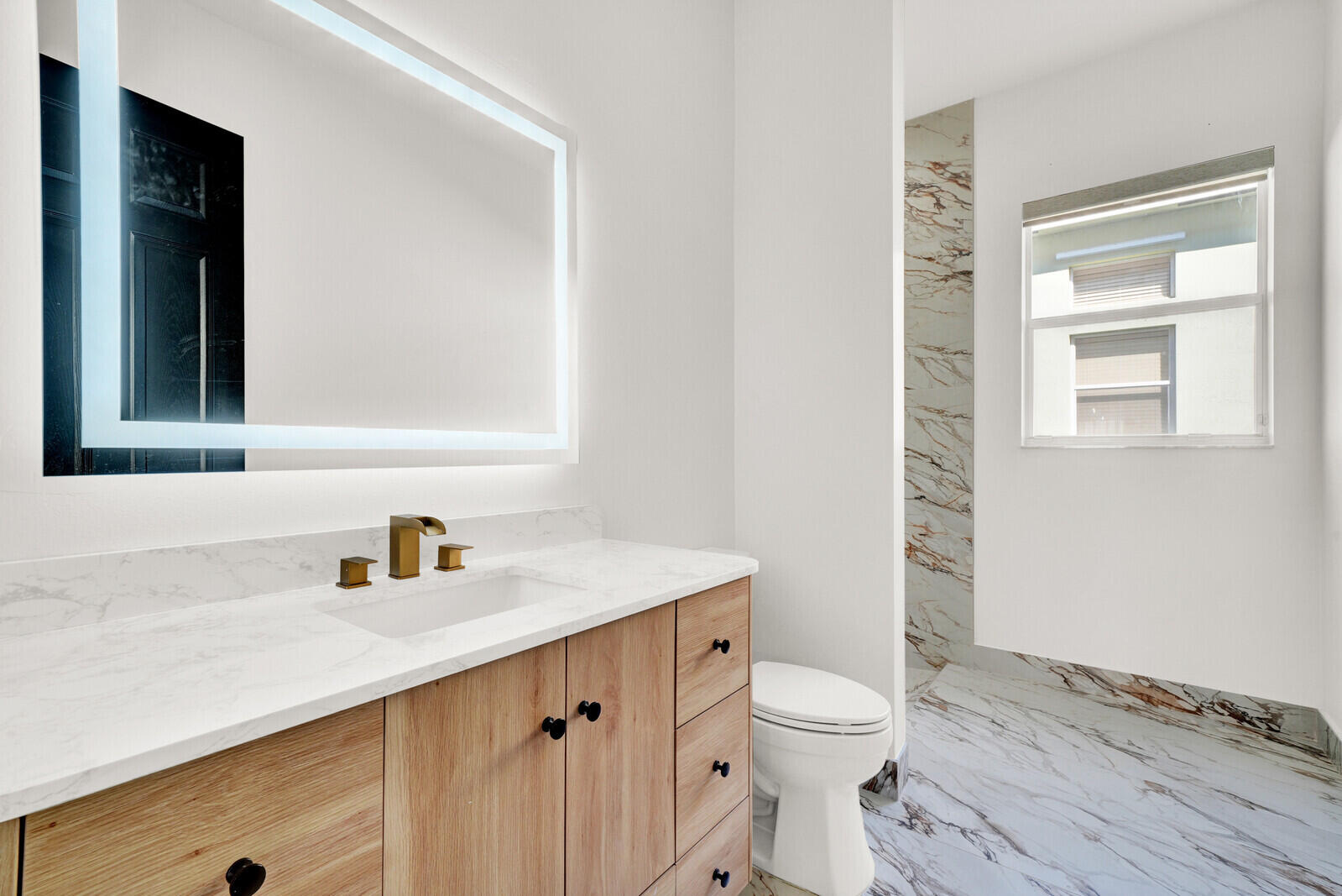 8685 Cobblestone Point Circle Boynton Beach, FL 33472 - Photo 29 of 70 a bathroom with a sink a toilet and a window