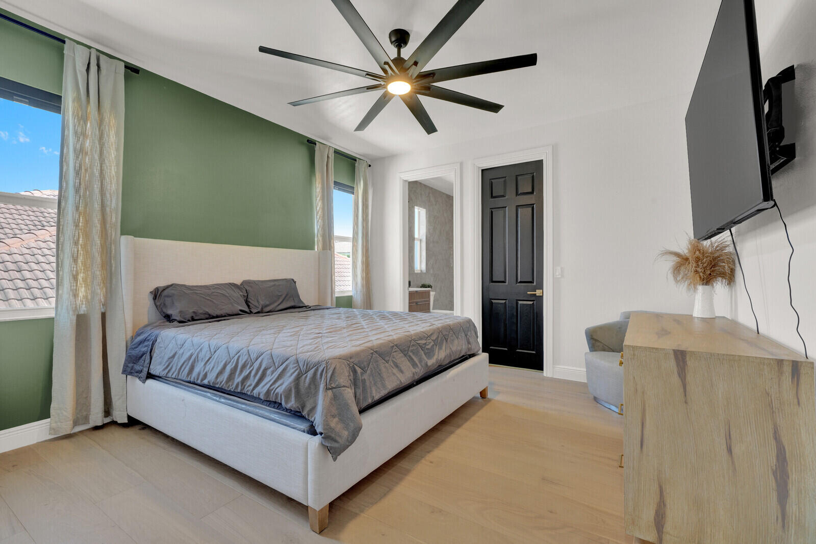 8685 Cobblestone Point Circle Boynton Beach, FL 33472 - Photo 40 of 70 a spacious bedroom with a bed and a flat screen tv