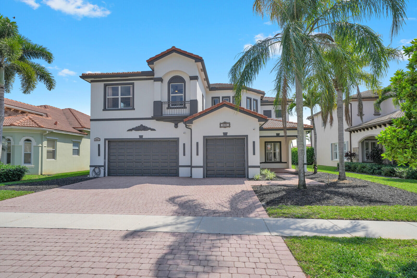 8685 Cobblestone Point Circle Boynton Beach, FL 33472 - Photo 4 of 70 a front view of a house with a yard and a garage