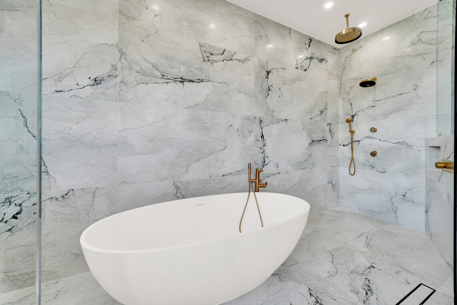 8685 Cobblestone Point Circle Boynton Beach, FL 33472 - Photo 49 of 70 a white bath tub sitting in a bathroom and a shower