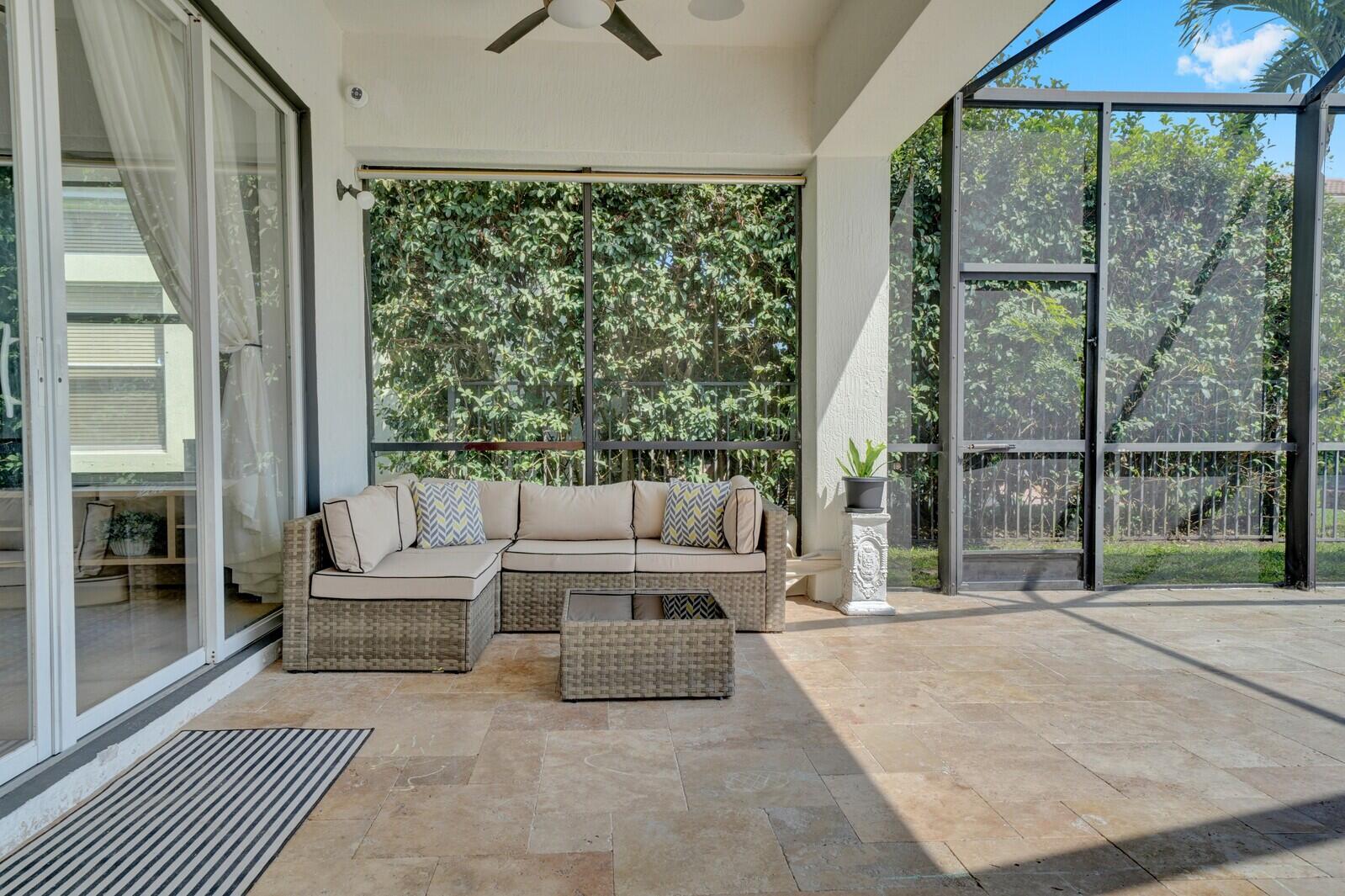 8685 Cobblestone Point Circle Boynton Beach, FL 33472 - Photo 52 of 70 a living room with furniture and a large window