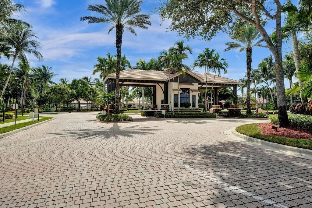 8685 Cobblestone Point Circle Boynton Beach, FL 33472 - Photo 70 of 70 a house with palm tree in front of it