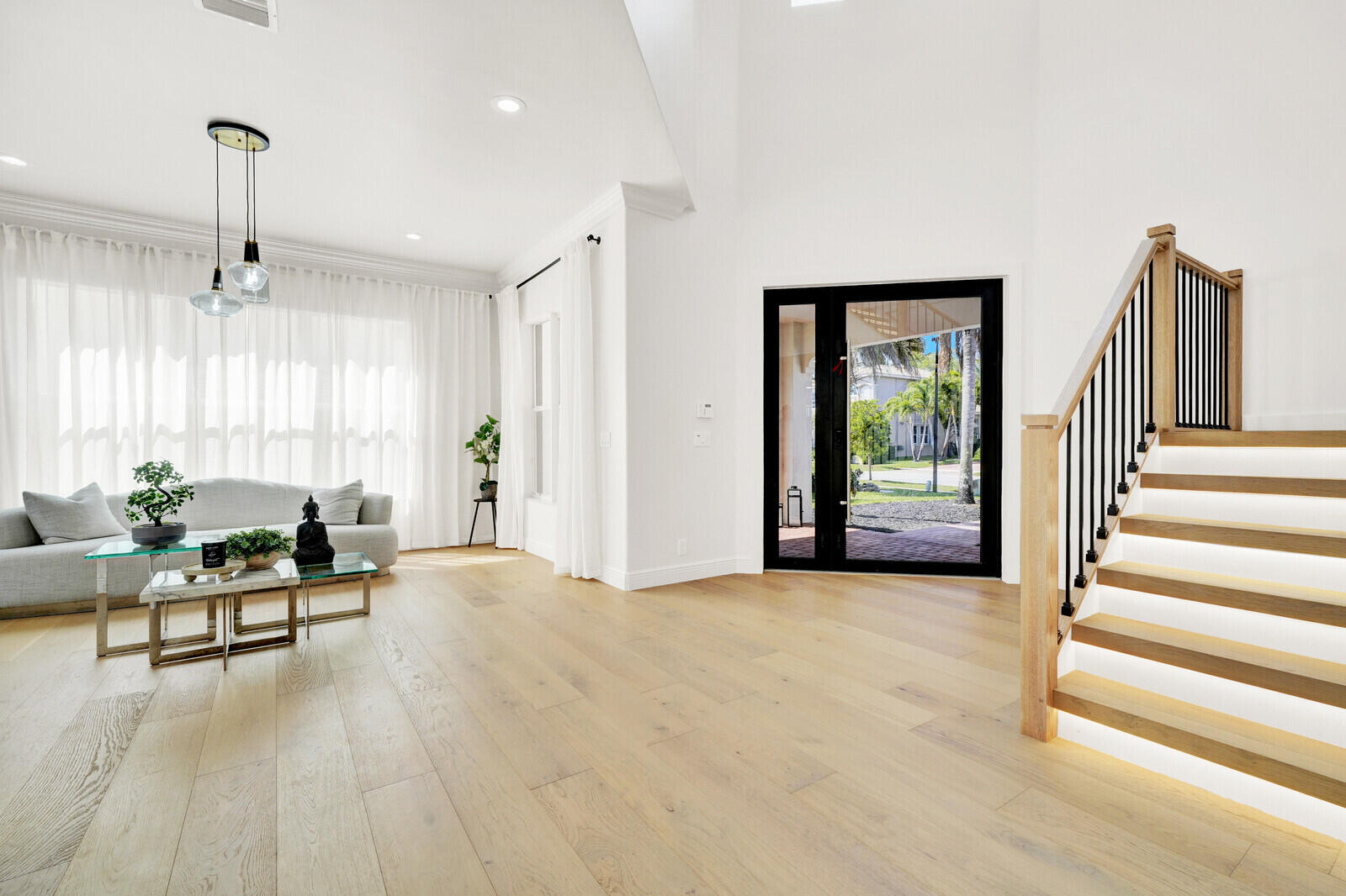 8685 Cobblestone Point Circle Boynton Beach, FL 33472 - Photo 7 of 70 a view of an empty room with wooden floor and a window