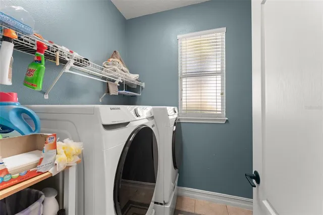 a utility room with dryer and washer