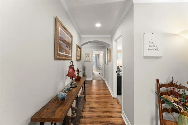 a view of a hallway with paintings on the wall