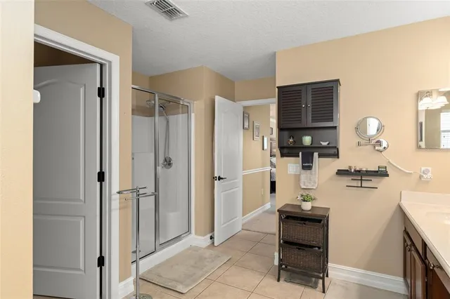 a kitchen with sink refrigerator and cabinets