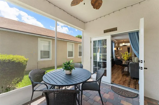 a view of a chairs and table in a balcony