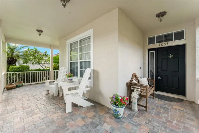 a view of a workspace with furniture and a gate