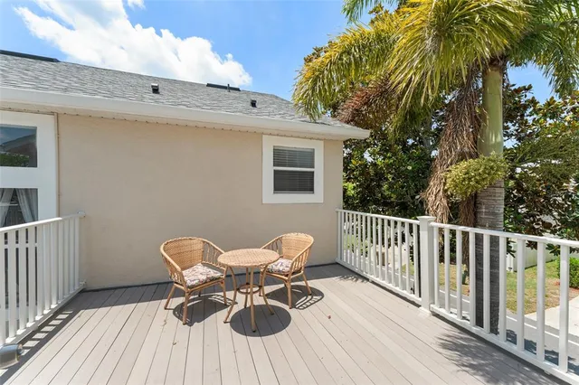 a view of a balcony with furniture