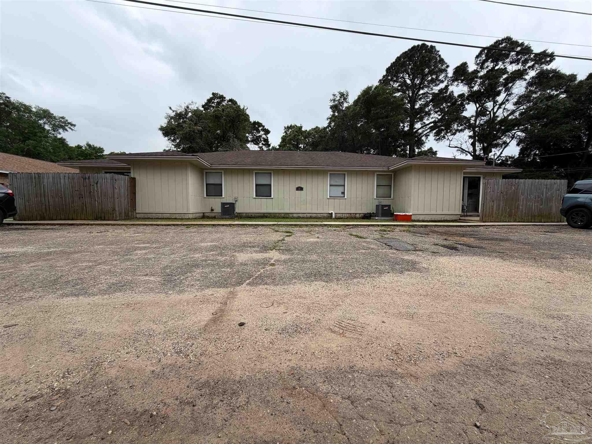 130 East 9 Mile Road Pensacola, FL 32534 - Photo 1 of 25 a house with trees in the background