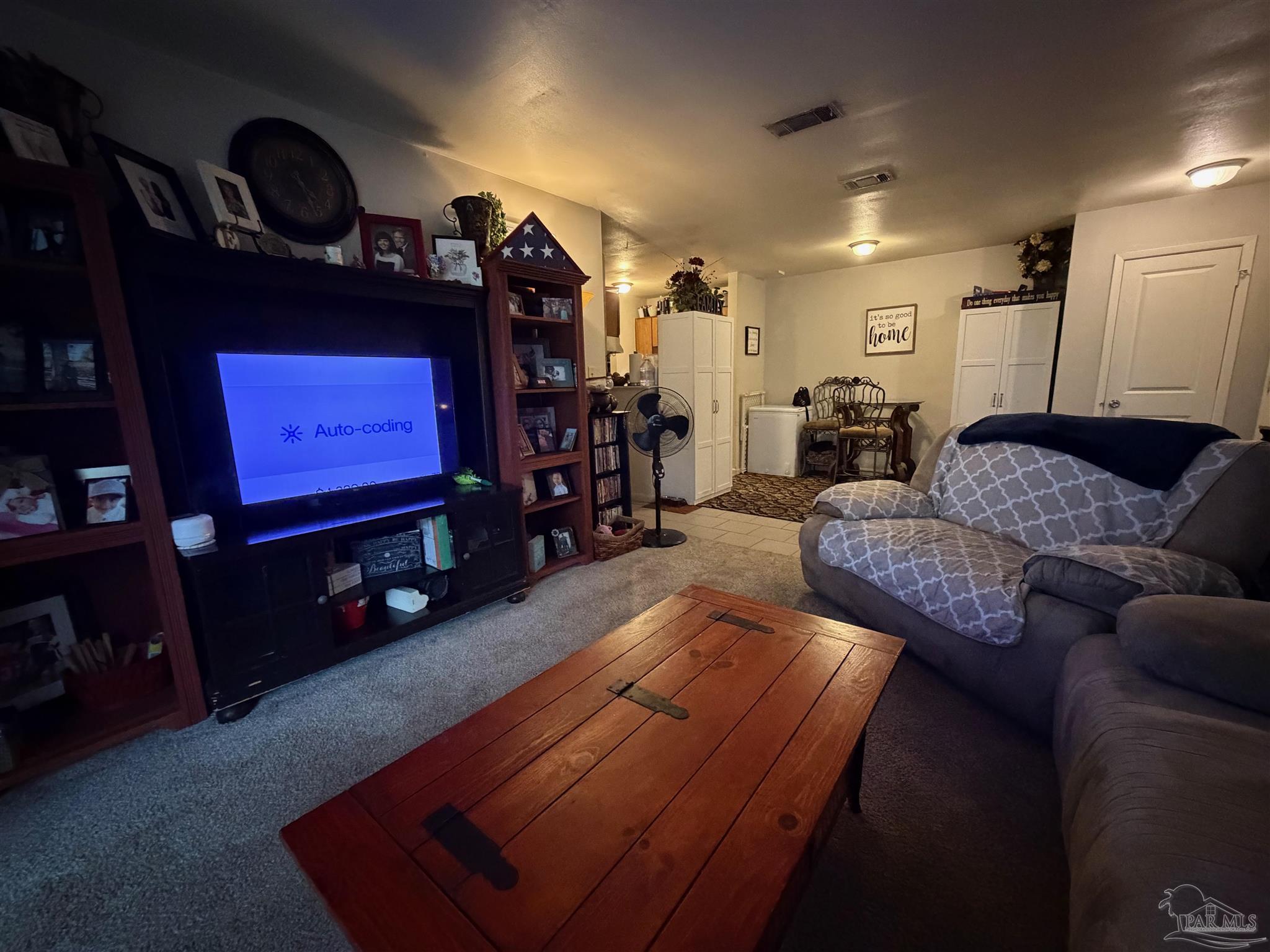 130 East 9 Mile Road Pensacola, FL 32534 - Photo 17 of 25 a living room with furniture and a flat screen tv