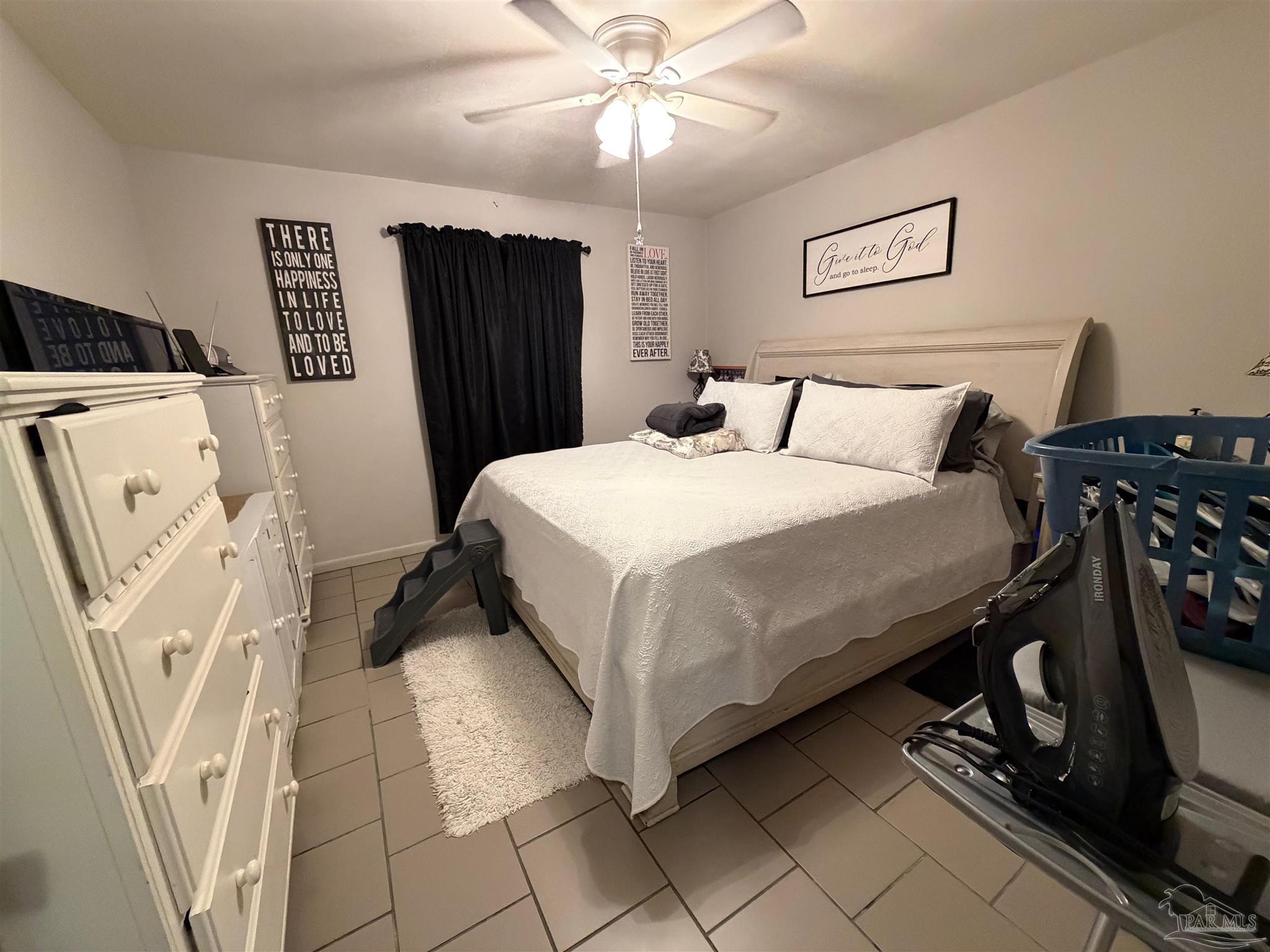 130 East 9 Mile Road Pensacola, FL 32534 - Photo 18 of 25 a bedroom with a bed and a walk in closet