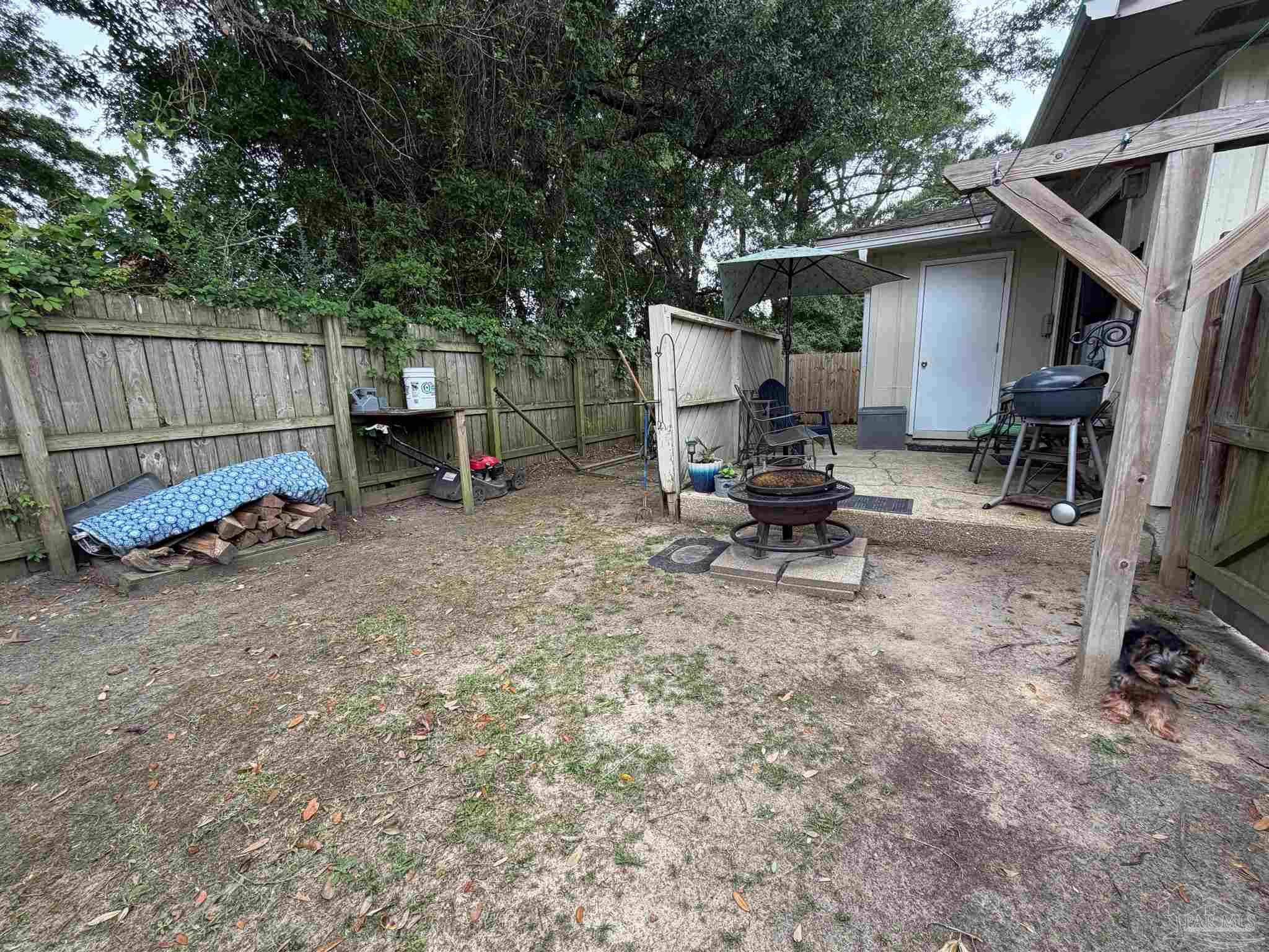 130 East 9 Mile Road Pensacola, FL 32534 - Photo 20 of 25 a view of backyard with a table and chairs