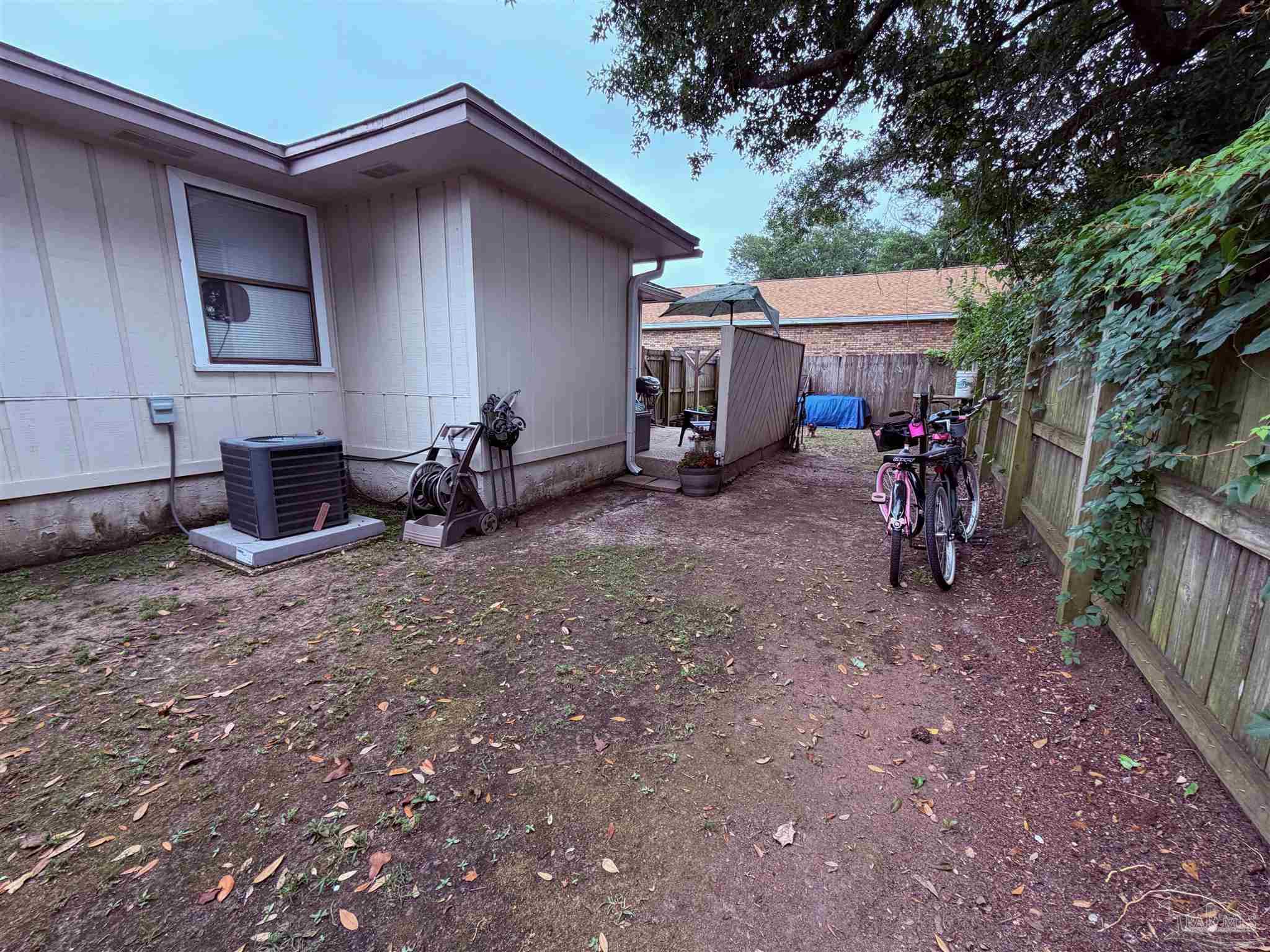 130 East 9 Mile Road Pensacola, FL 32534 - Photo 22 of 25 a view of a house with backyard and sitting area