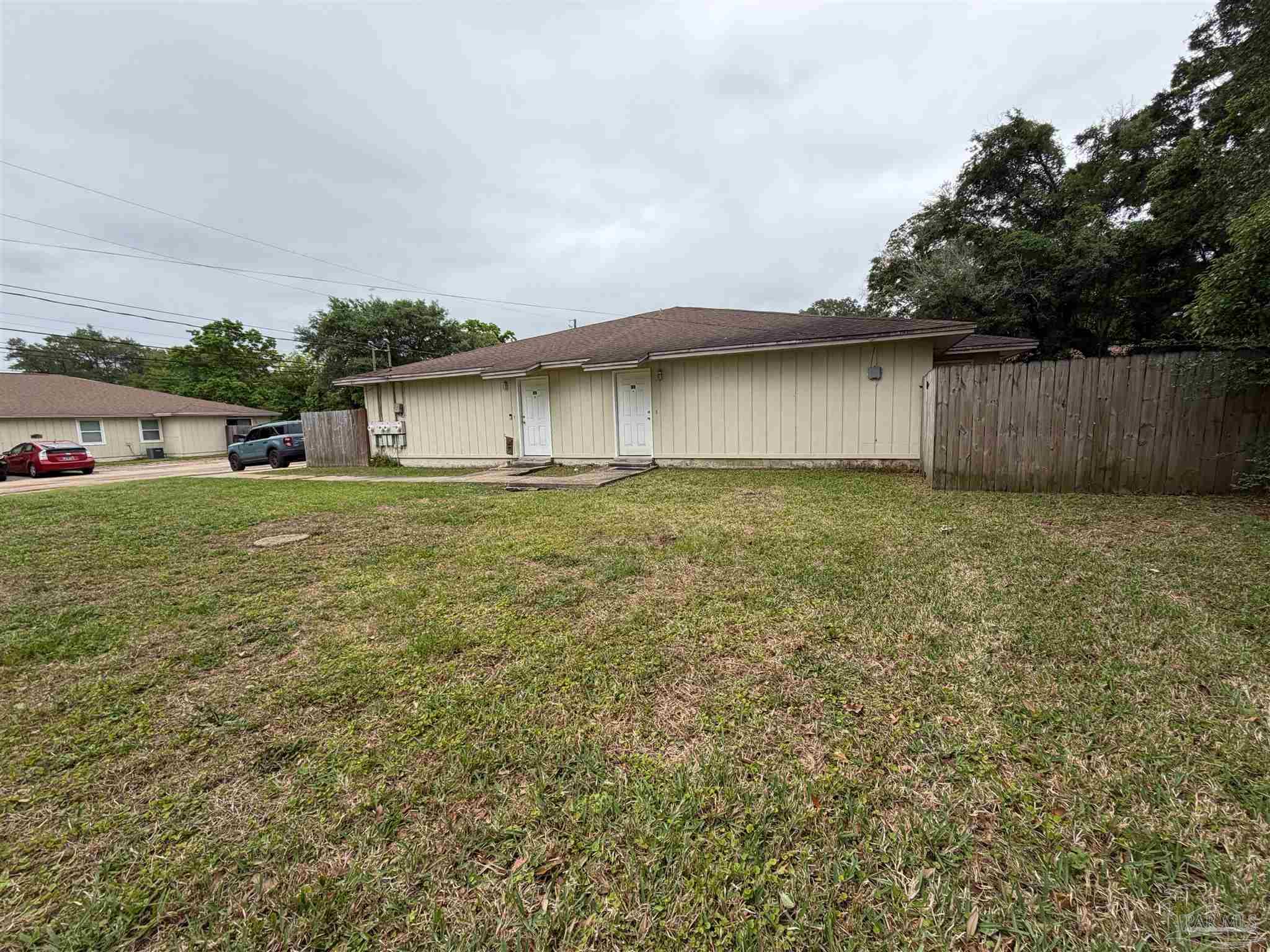 130 East 9 Mile Road Pensacola, FL 32534 - Photo 25 of 25 a big yard with wooden fence
