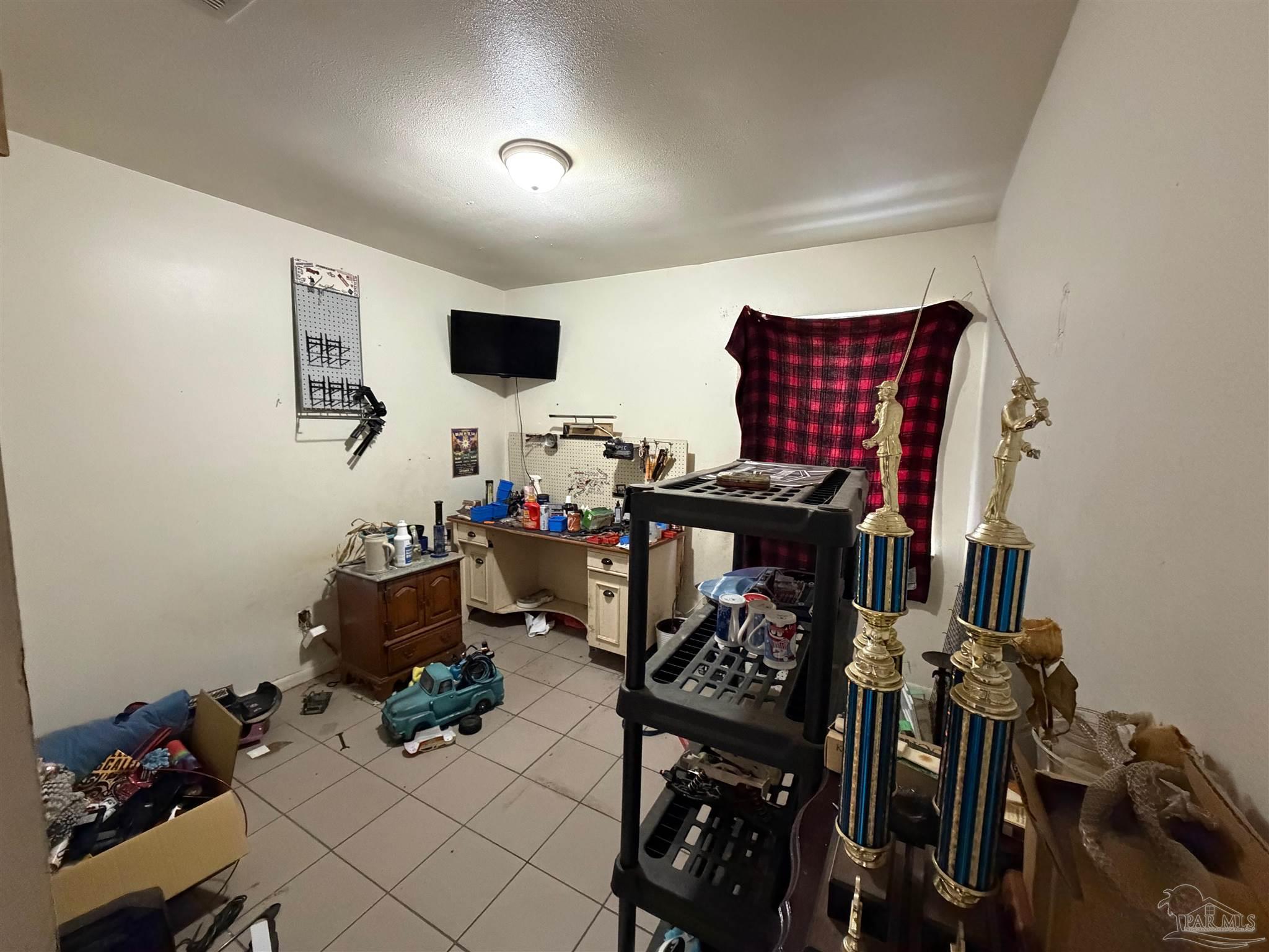 130 East 9 Mile Road Pensacola, FL 32534 - Photo 9 of 25 a view of a workspace with furniture